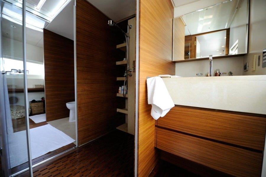 a bathroom with a glass shower aboard TROPICANA Yacht for Charter