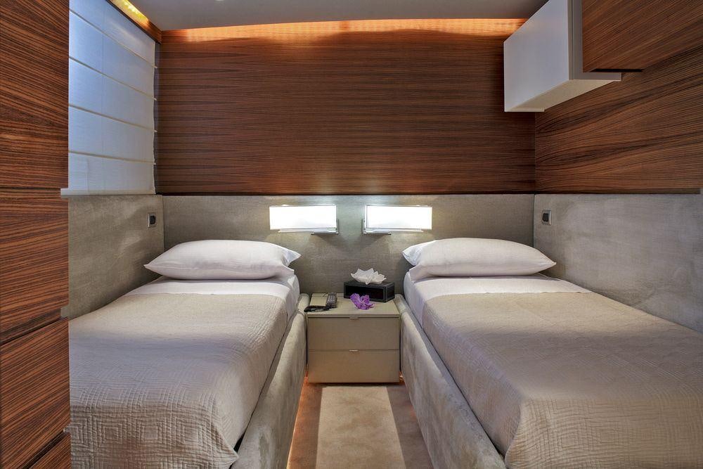 a couple of beds in a room aboard TROPICANA Yacht for Charter