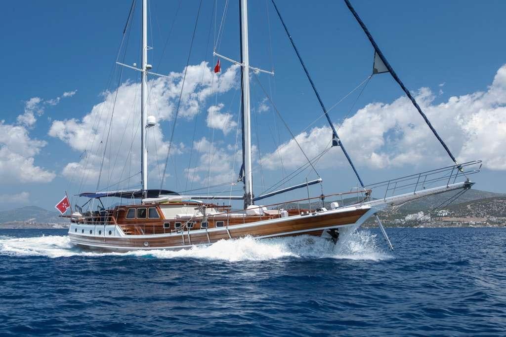a boat sailing on the water aboard AREA Yacht for Charter