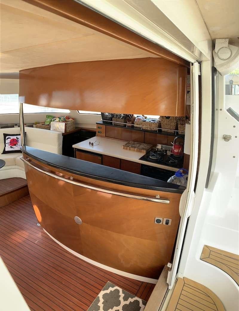 a kitchen with a countertop aboard VIVO Yacht for Charter