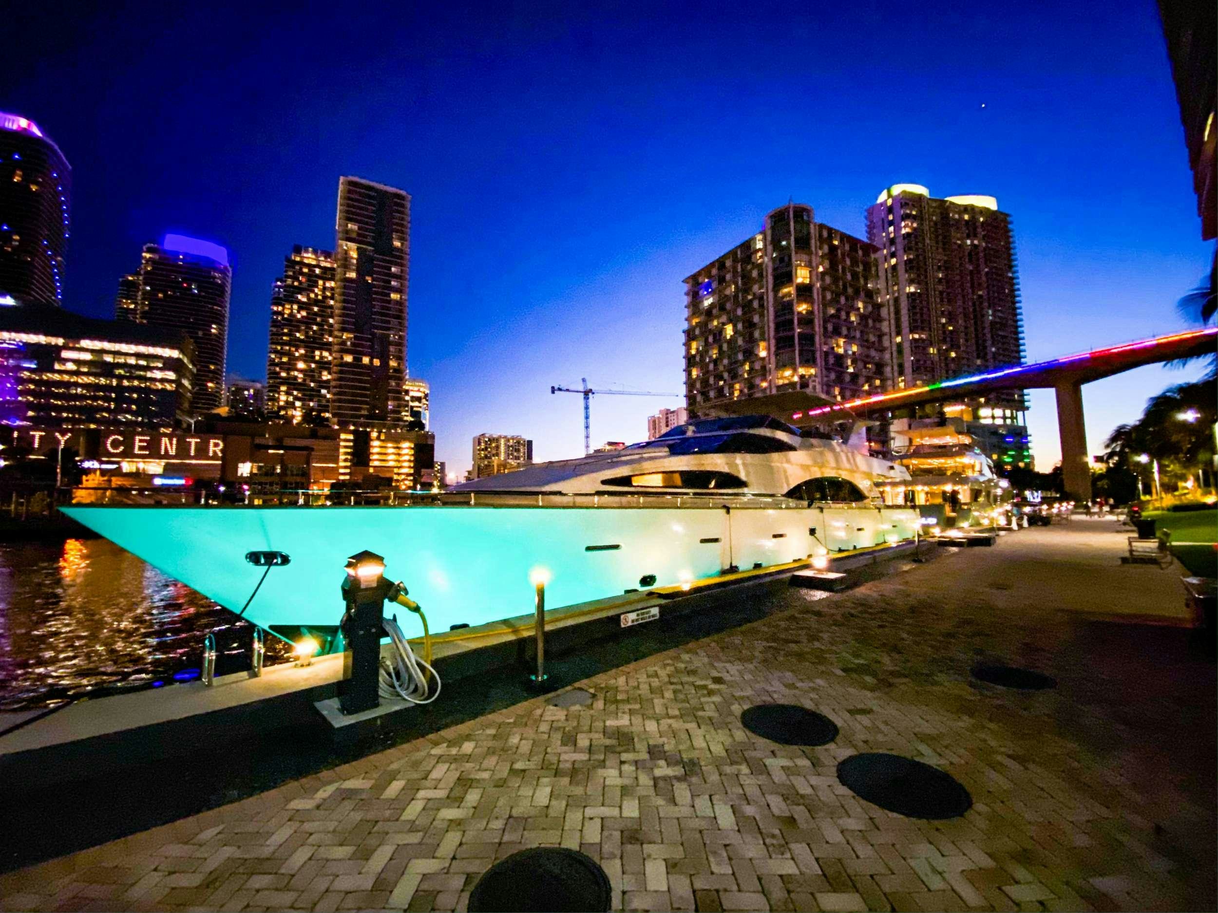 a person on a bike by a pool with buildings in the background aboard REFLECTIONS Yacht for Charter