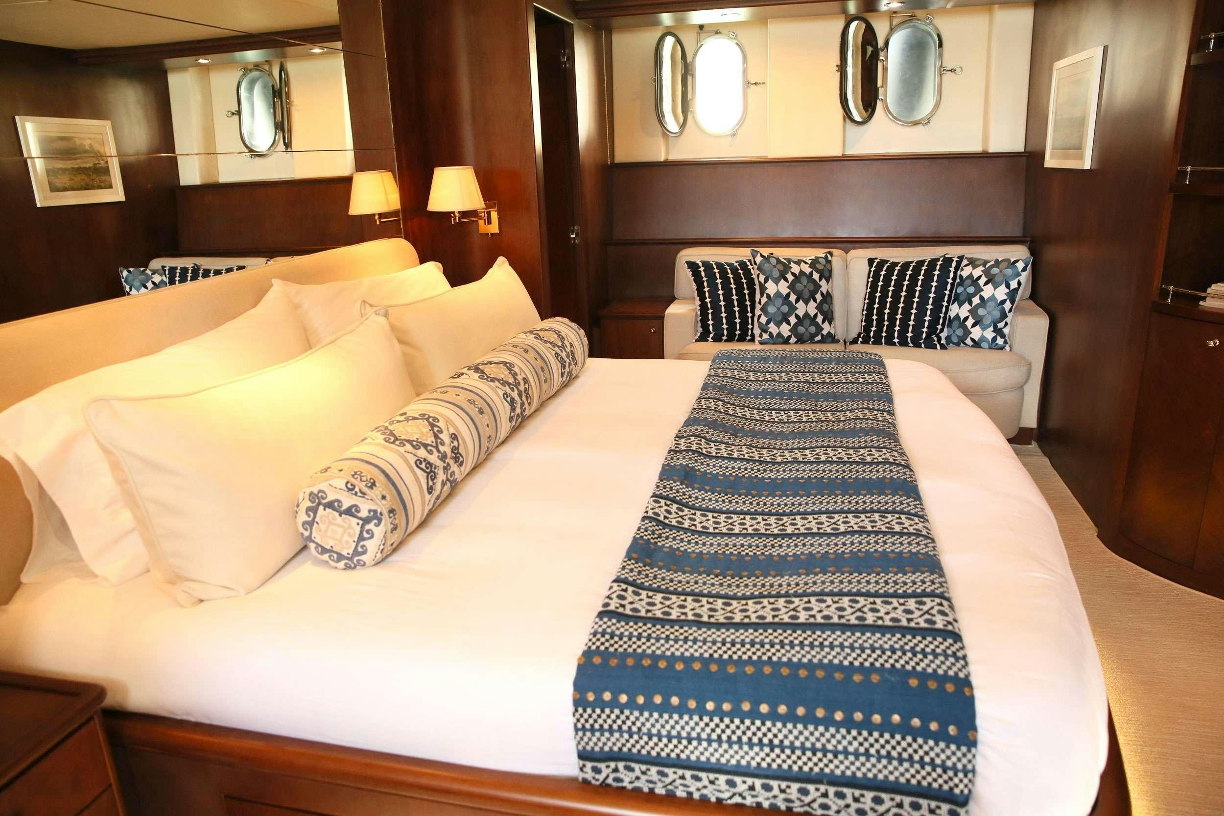 a hotel room with a bed aboard REFLECTIONS Yacht for Charter