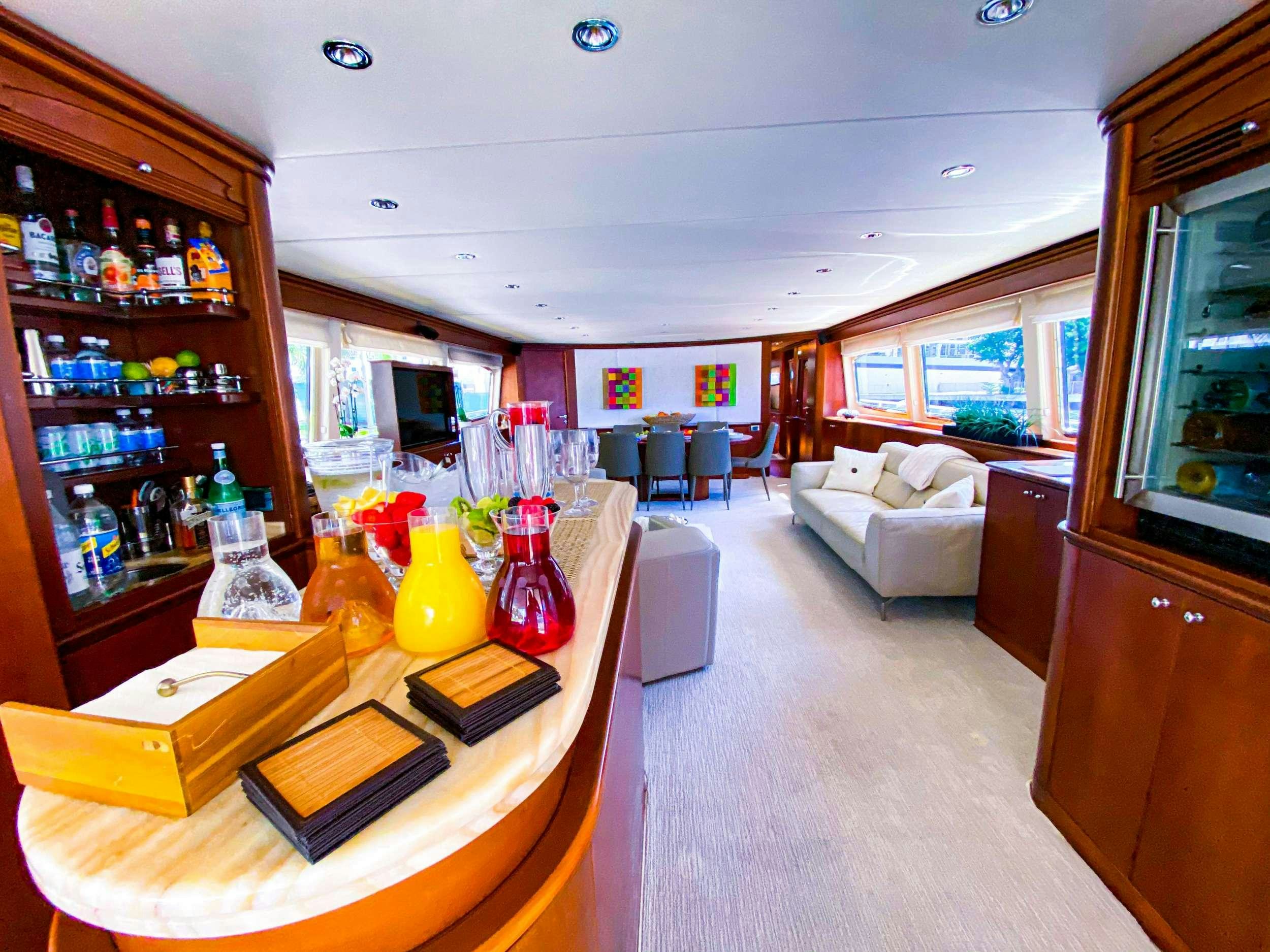 a room with a table and chairs aboard REFLECTIONS Yacht for Charter