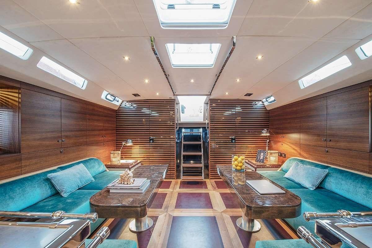 a living room with a wood floor aboard TUSCAN SPIRIT Yacht for Charter