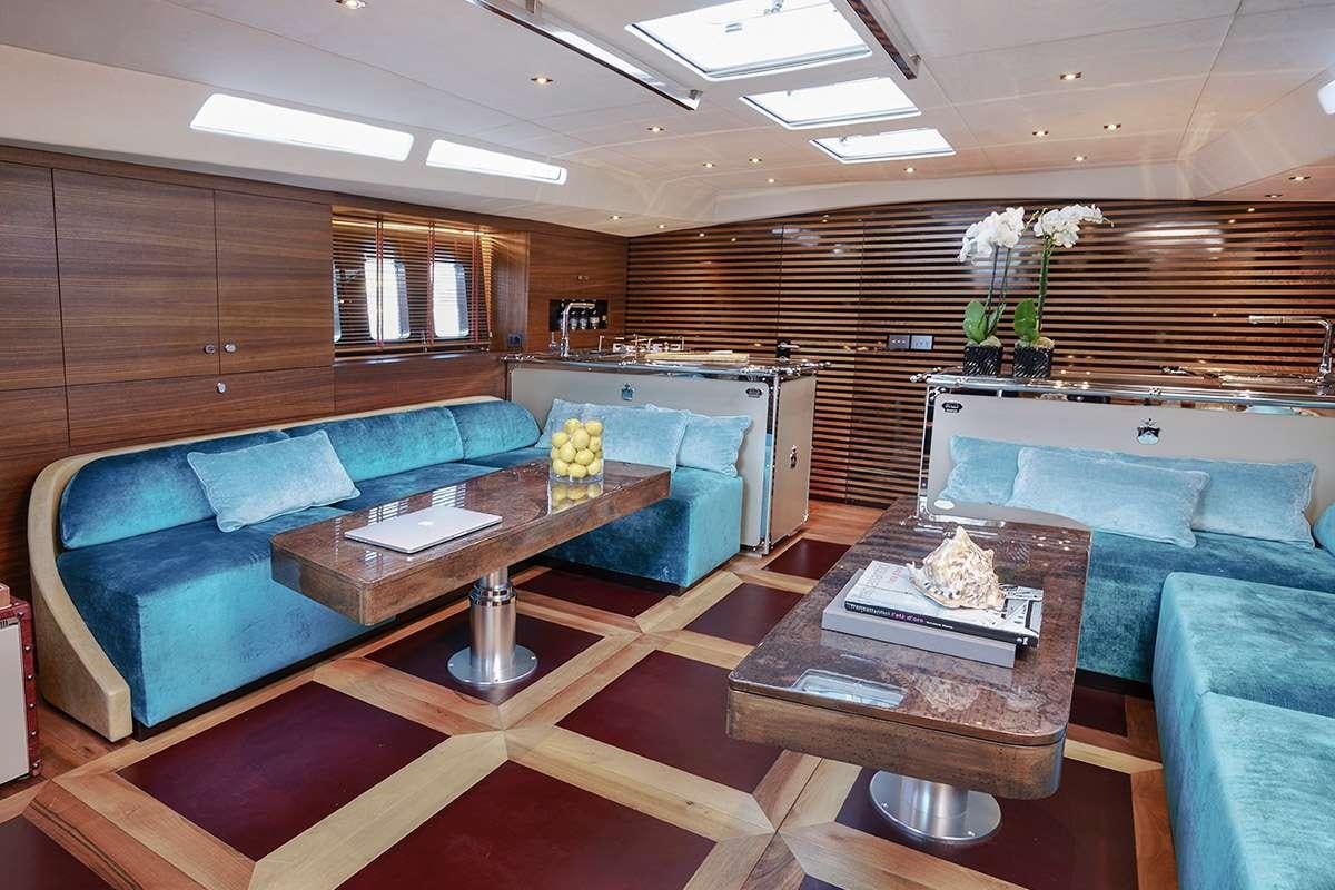 a living room with a couch and a coffee table aboard TUSCAN SPIRIT Yacht for Charter