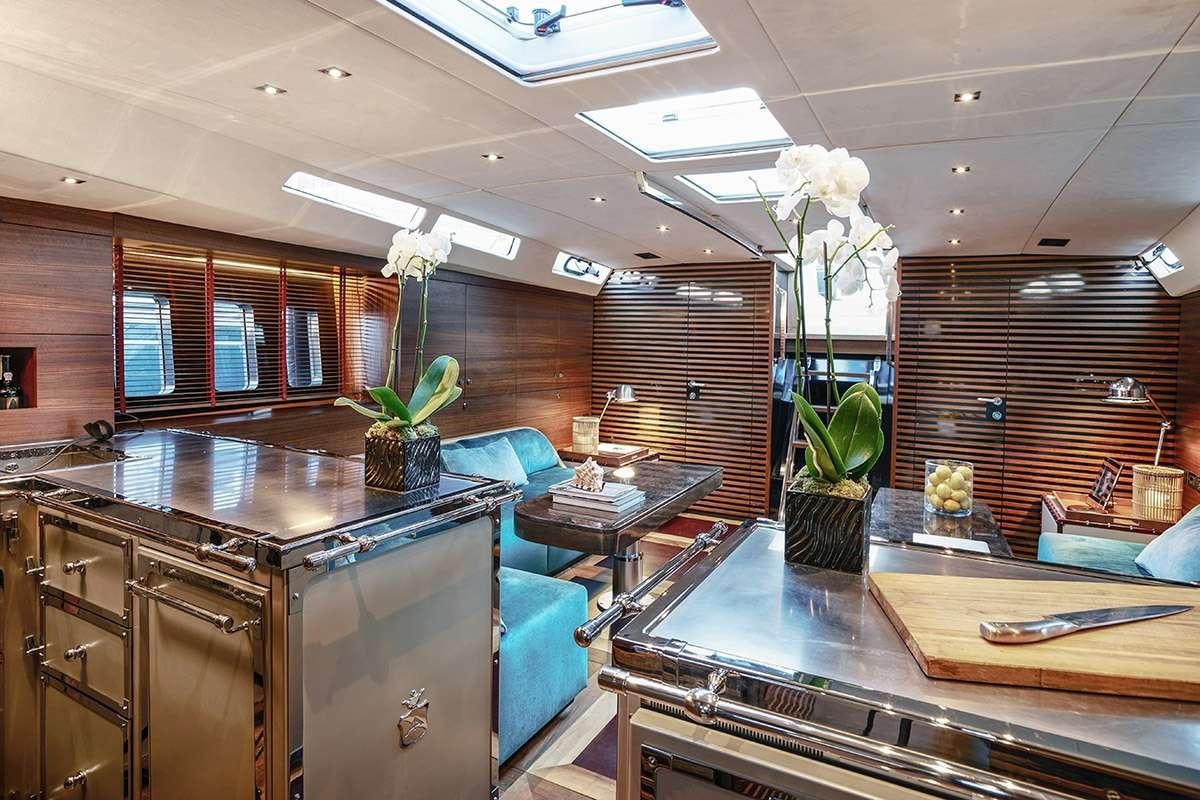 a kitchen with a counter and cabinets aboard TUSCAN SPIRIT Yacht for Charter