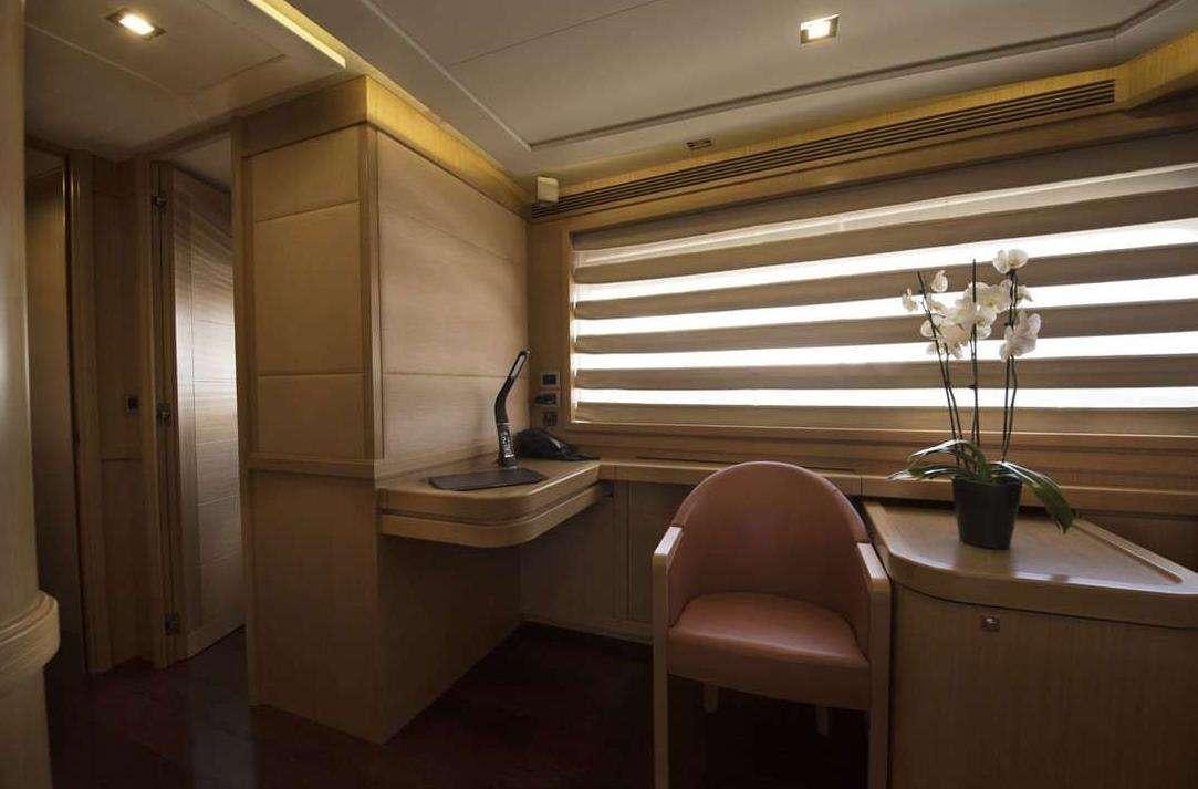 a kitchen with a sink and a chair aboard DANA Yacht for Charter