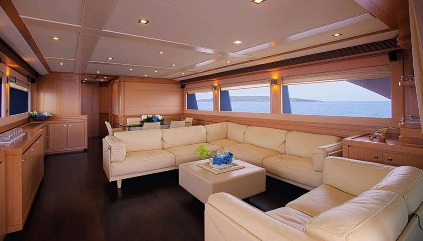 a living room with a large window aboard DANA Yacht for Charter