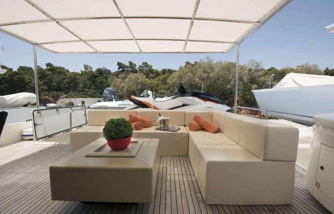 a patio with a table and chairs aboard DANA Yacht for Charter