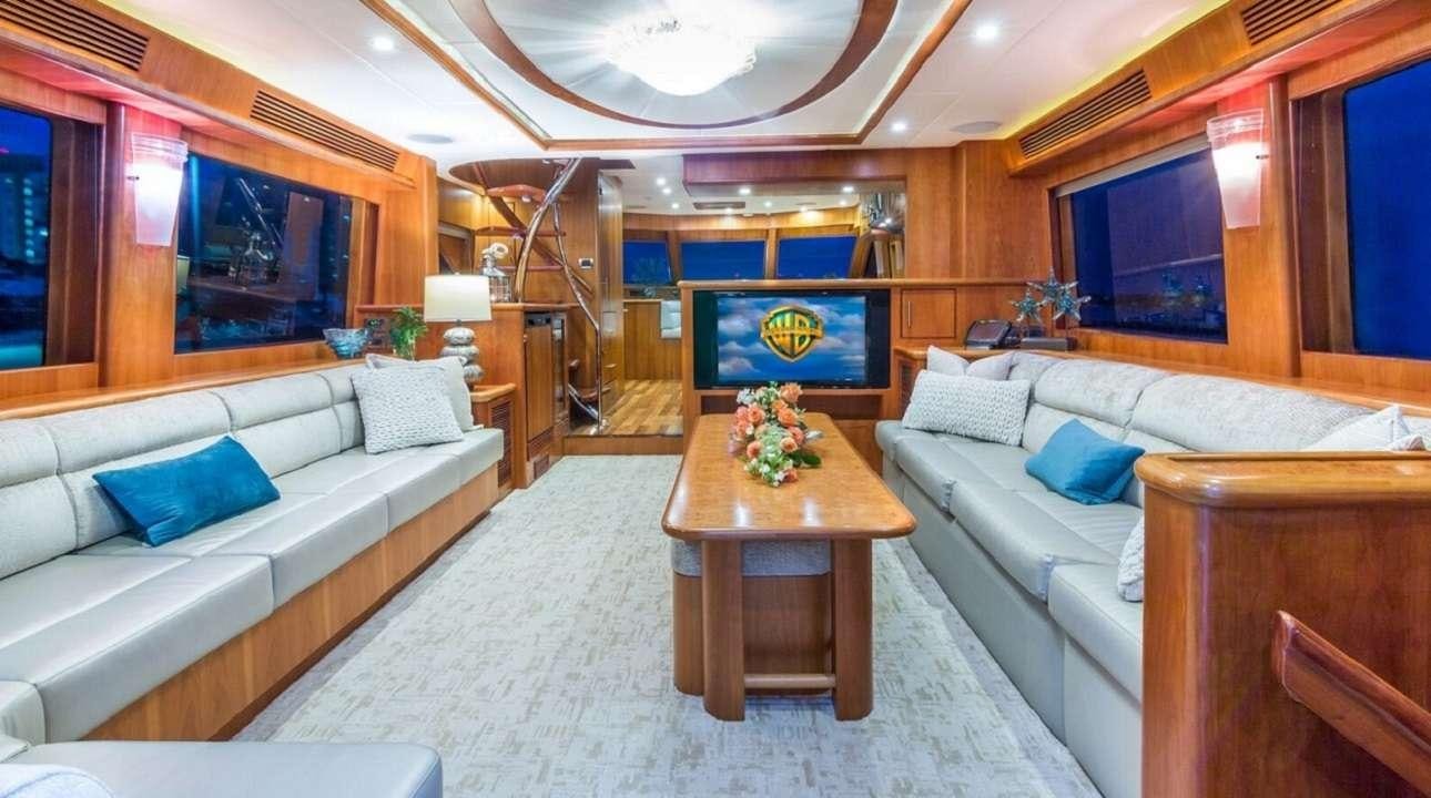 a living room with a couch and a coffee table aboard ANDIAMO Yacht for Charter