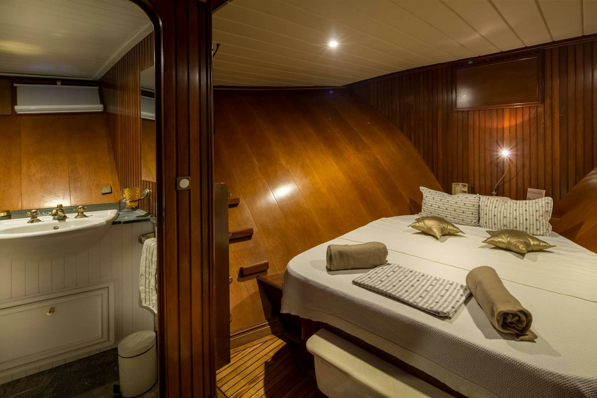 a bed in a room aboard Summer Princess Yacht for Charter