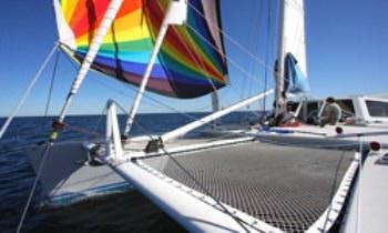 a boat with a rainbow flag aboard SKYLARK Yacht for Charter