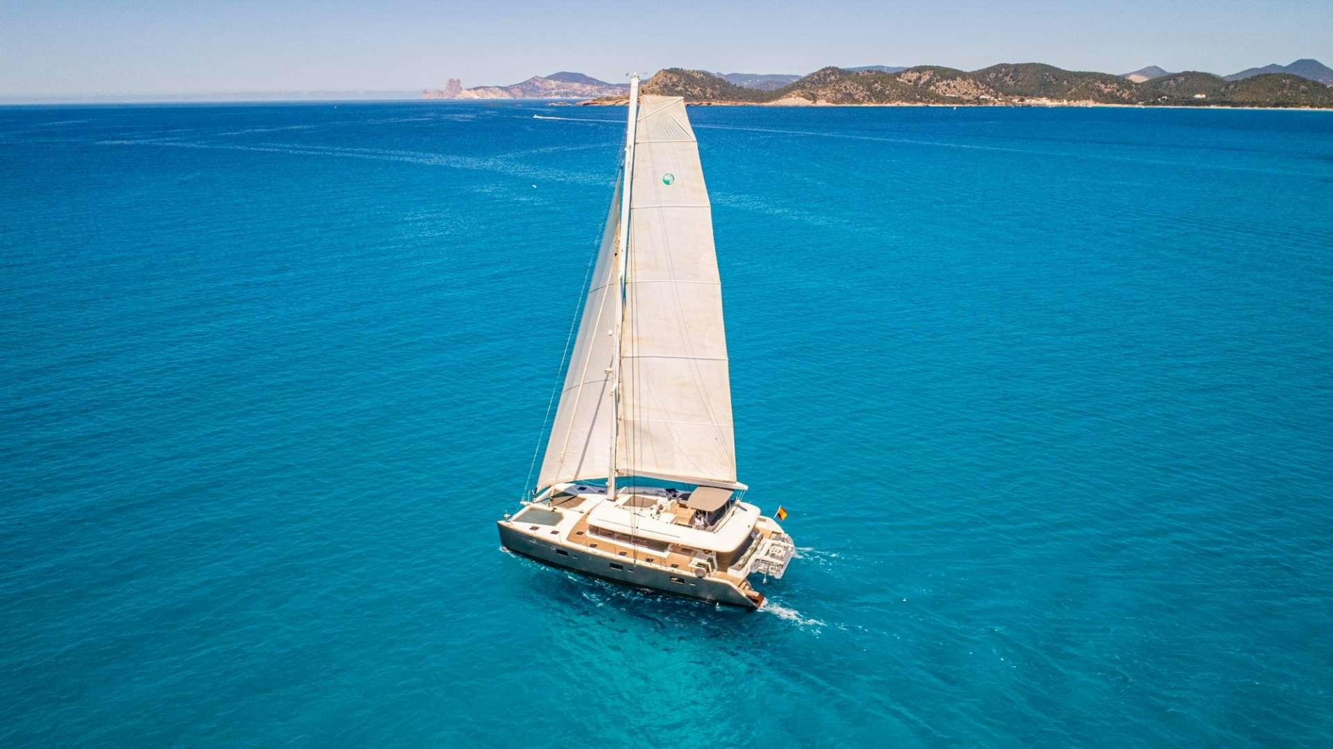 a boat sailing on the sea aboard FIREFLY Yacht for Charter