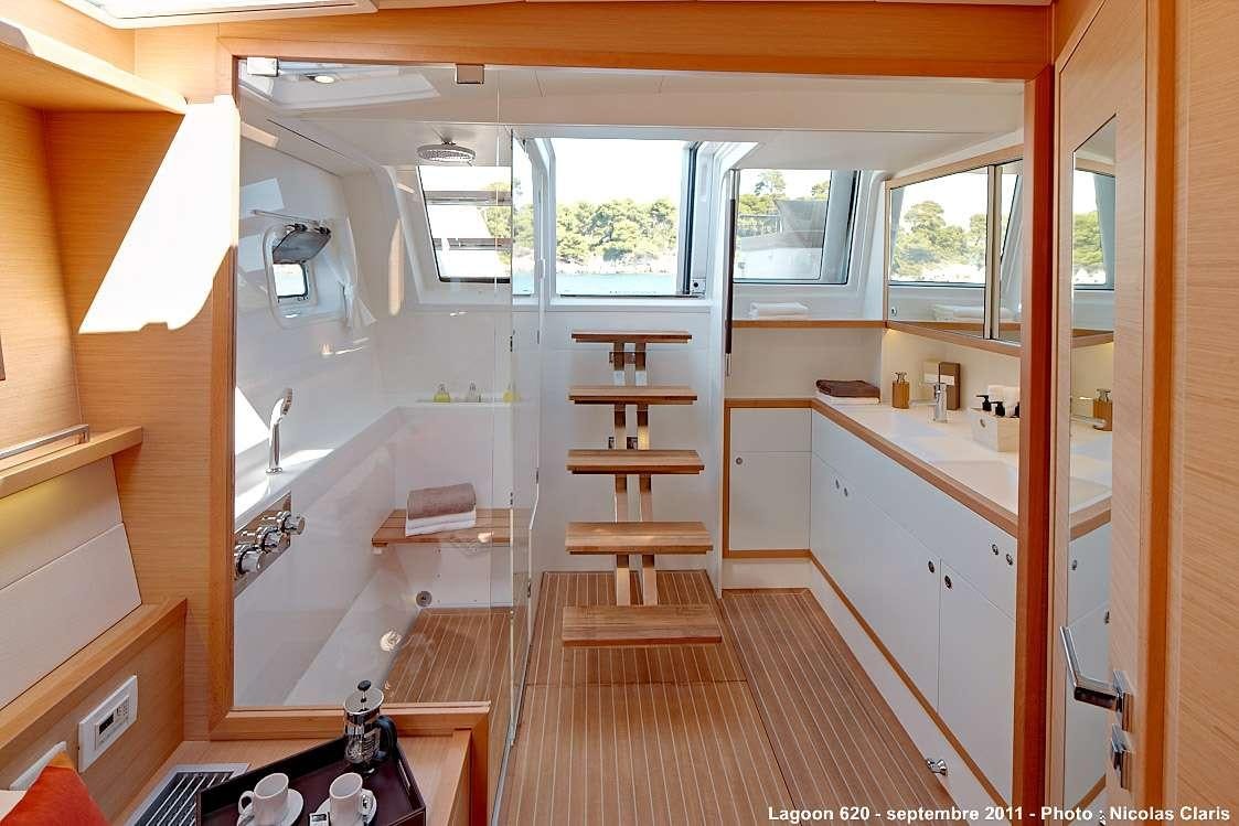 a bathroom with a wood floor aboard FIREFLY Yacht for Charter