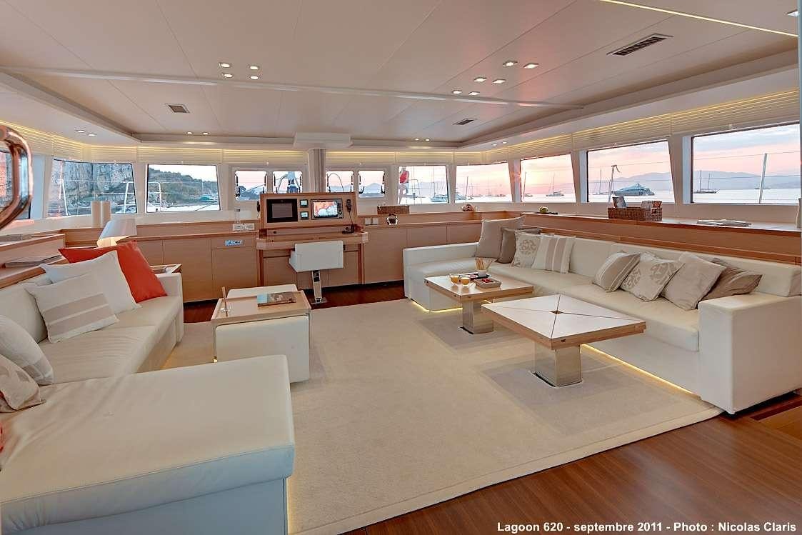 a room with couches and tables aboard FIREFLY Yacht for Charter
