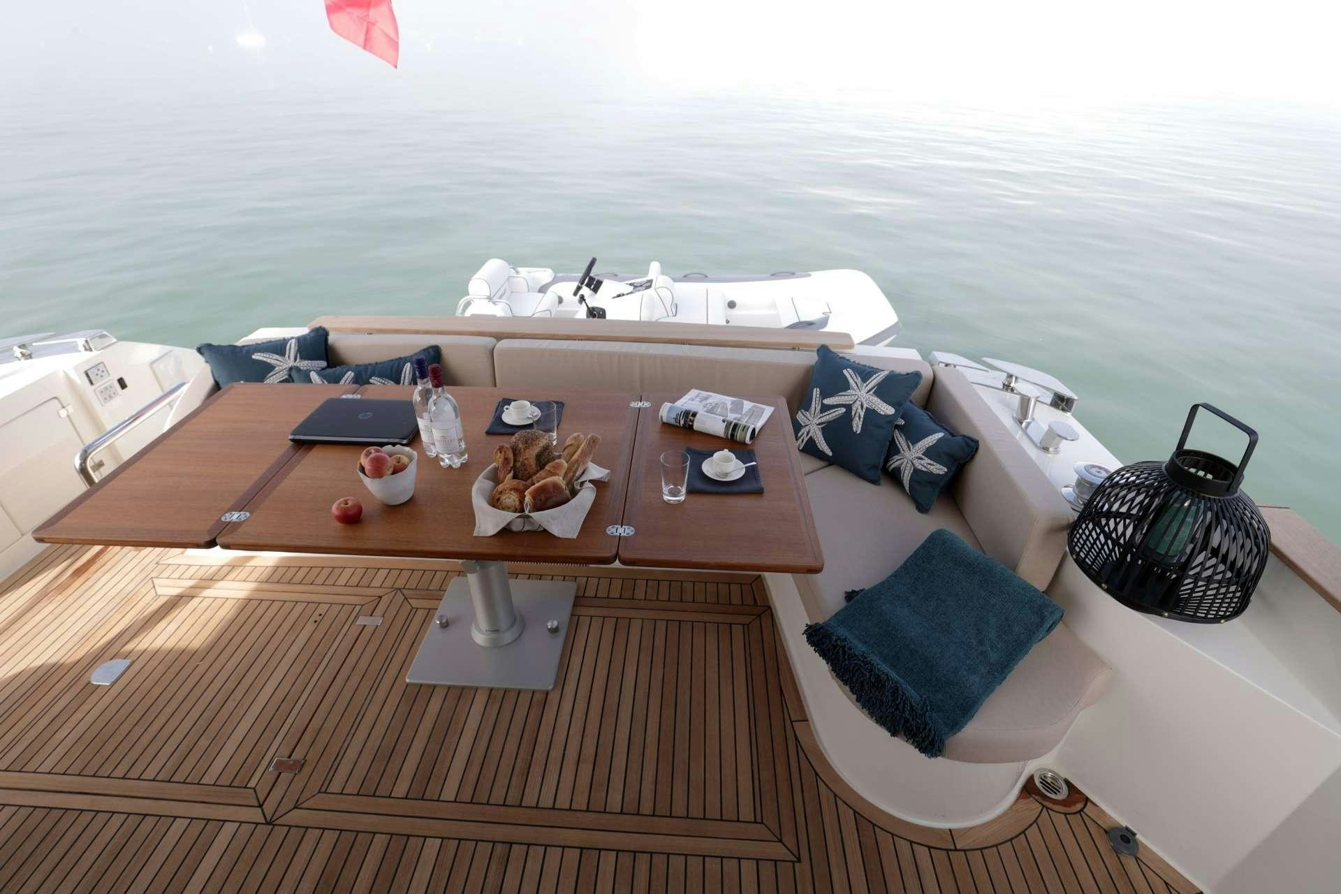 a table with food on it aboard ARMONEE Yacht for Charter