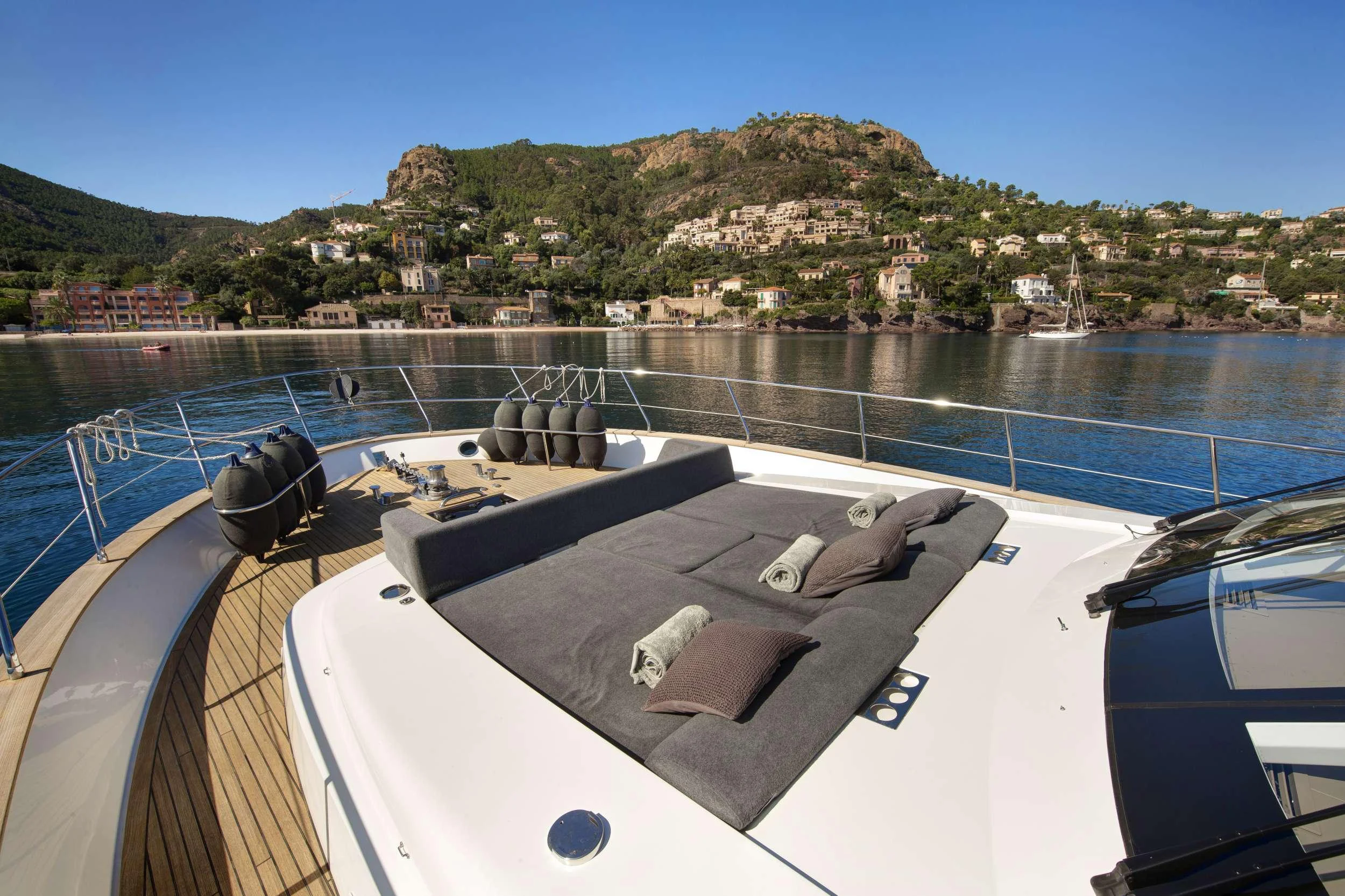 a deck with a large body of water and a couple of chairs on it aboard ARMONEE Yacht for Charter