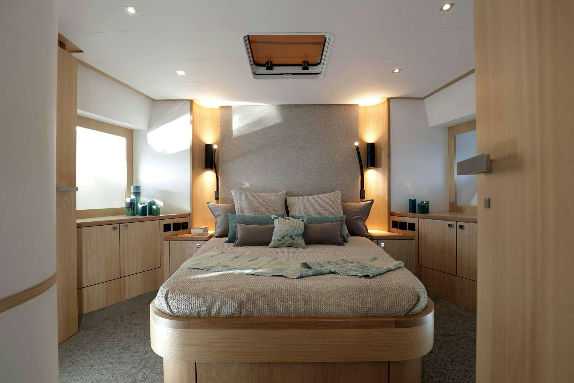 a bed in a room aboard ARMONEE Yacht for Charter