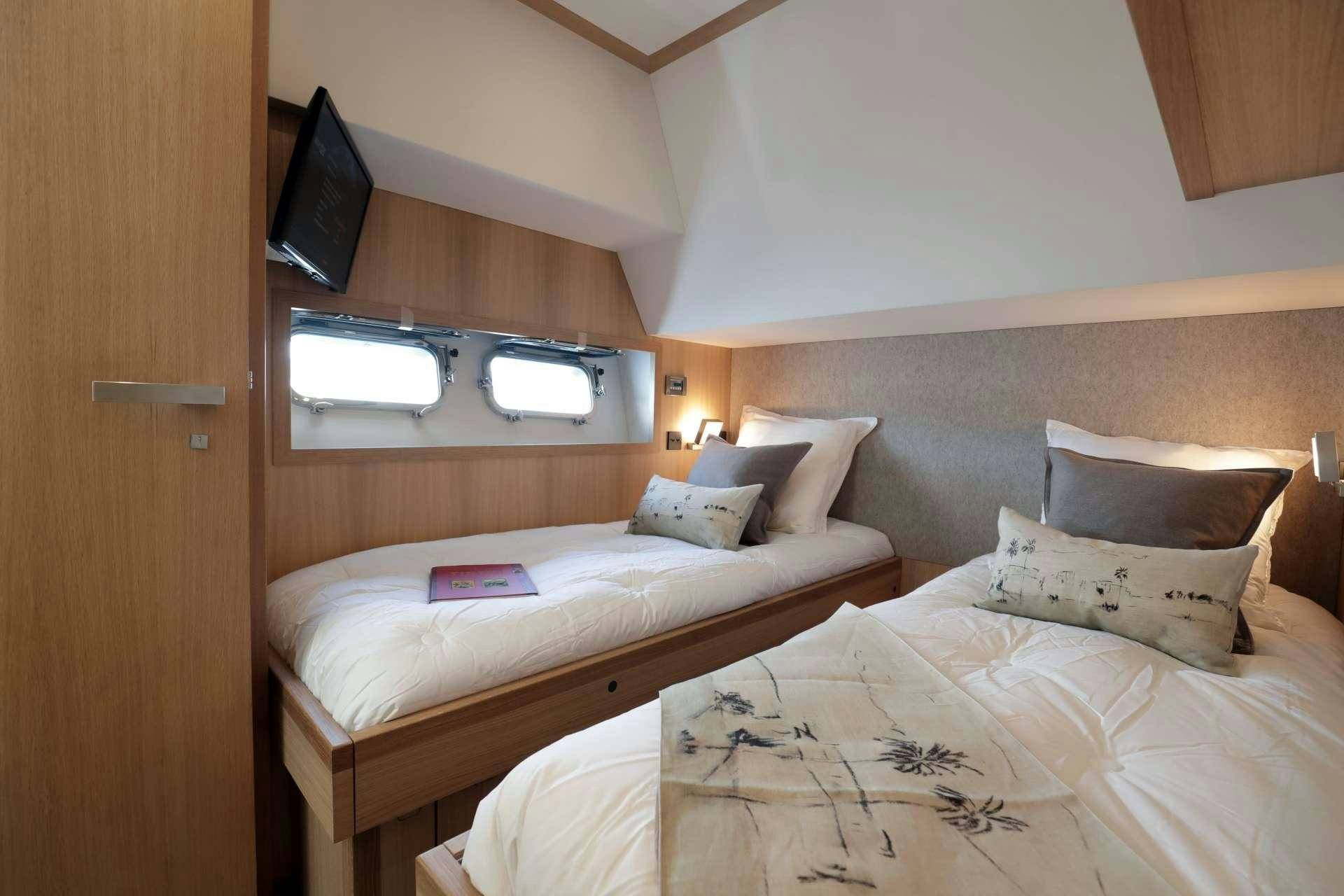a room with two beds aboard ARMONEE Yacht for Charter