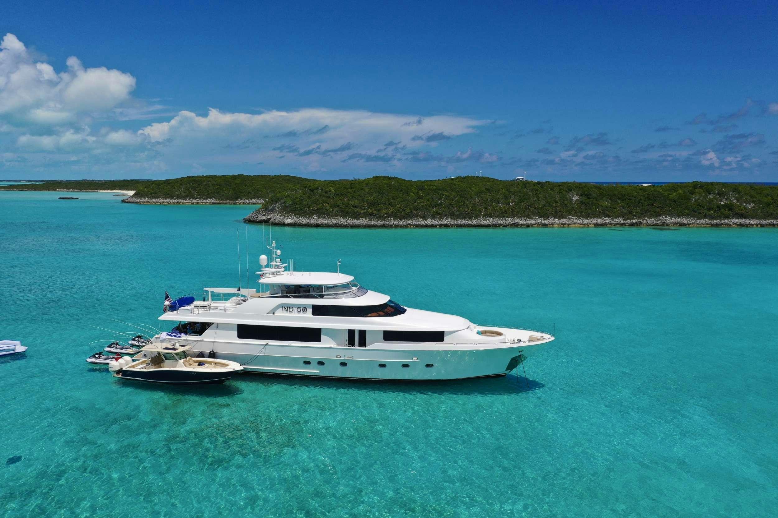 a white boat in the water aboard INDIGO Yacht for Charter