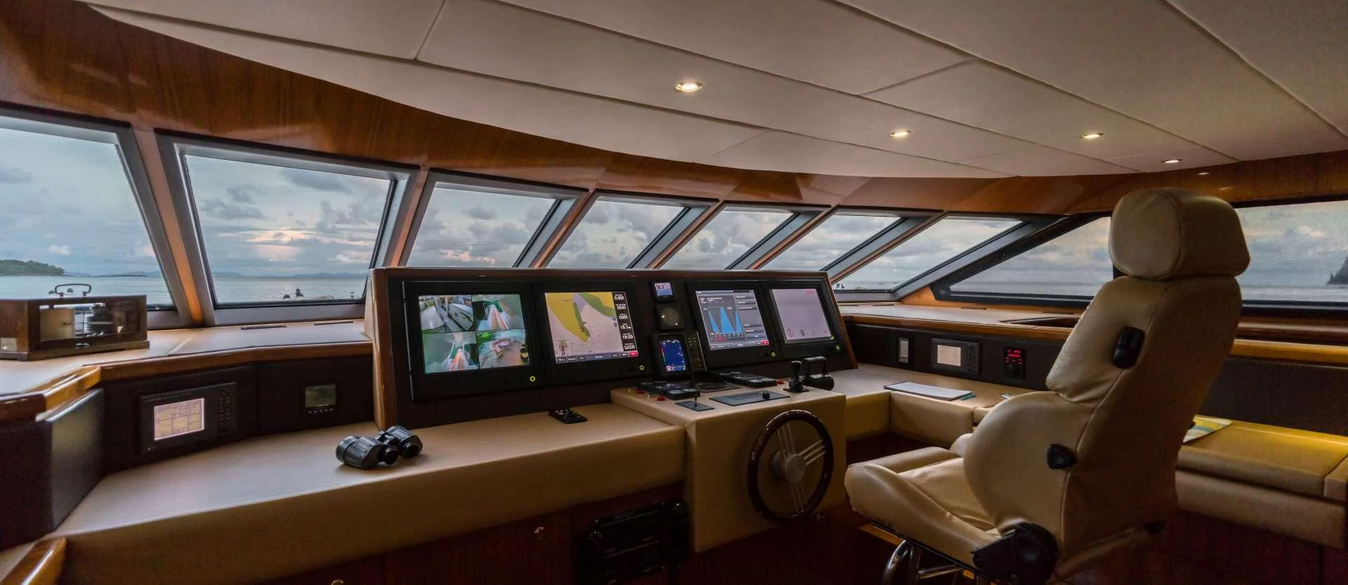 a room with many monitors and chairs aboard XANADU OF LONDON Yacht for Charter