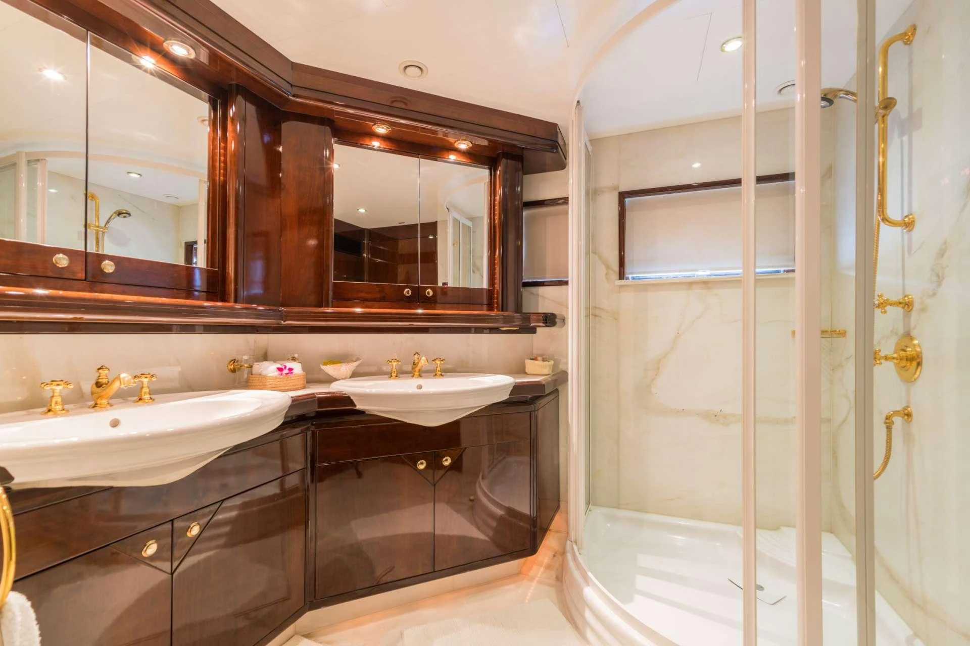 a bathroom with a large mirror aboard XANADU OF LONDON Yacht for Charter