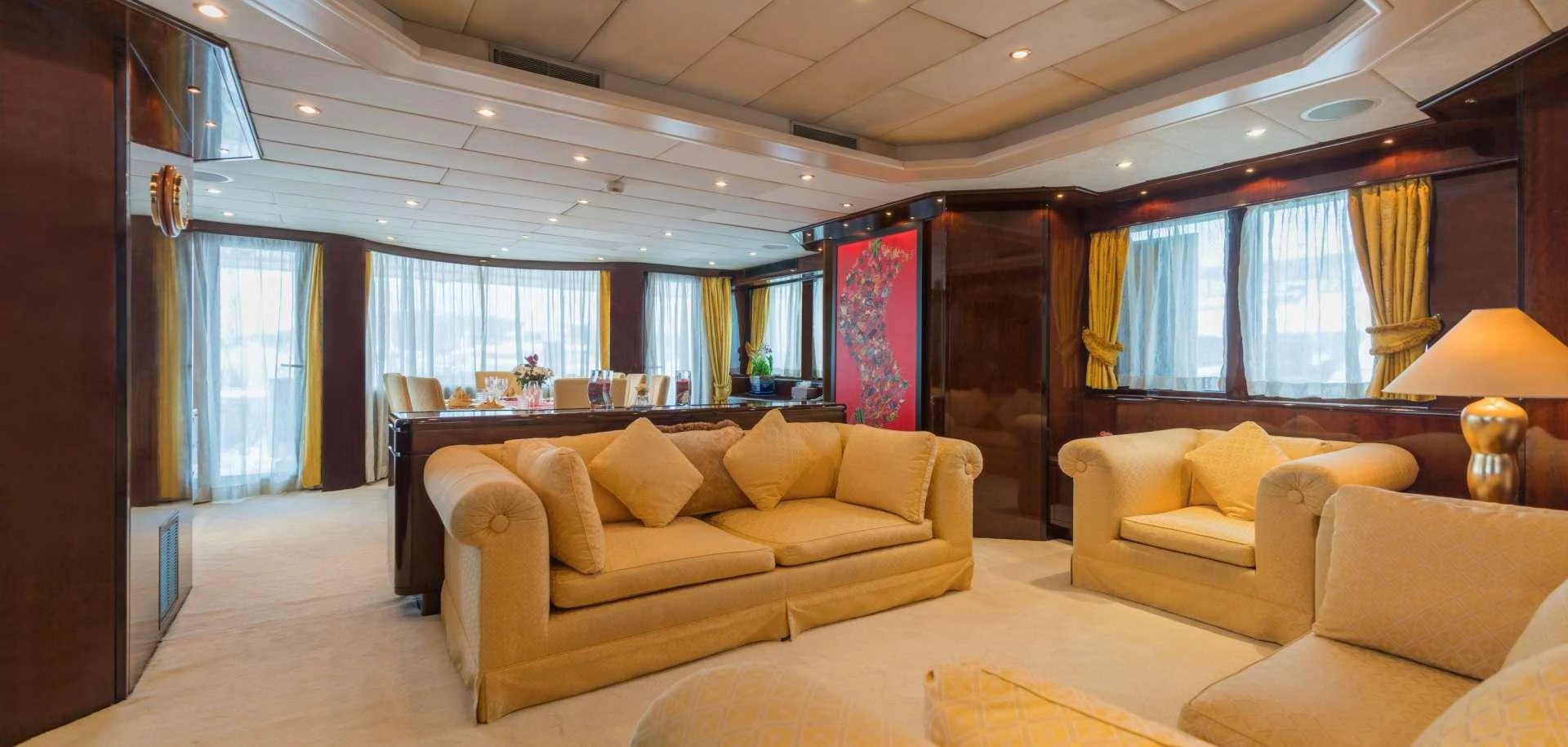 a living room with a couch and a table aboard XANADU OF LONDON Yacht for Charter