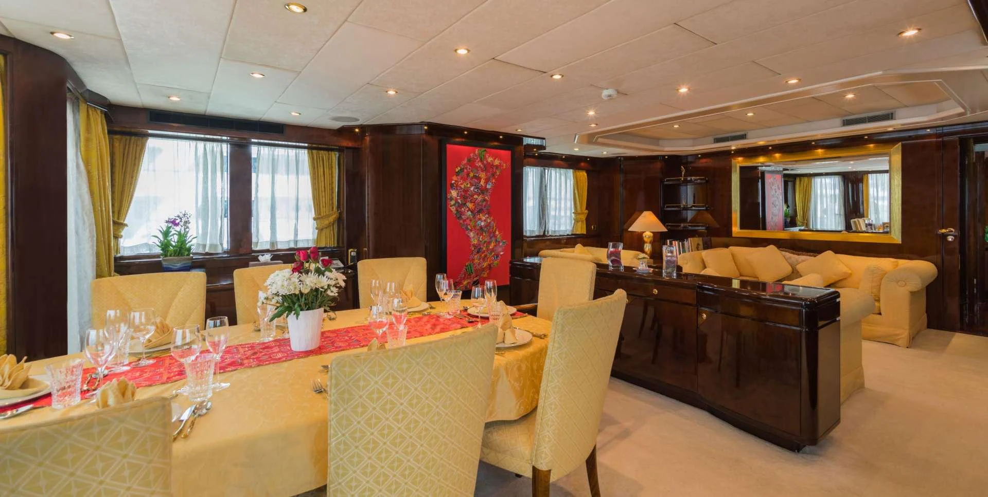 a large room with a table and chairs aboard XANADU OF LONDON Yacht for Charter
