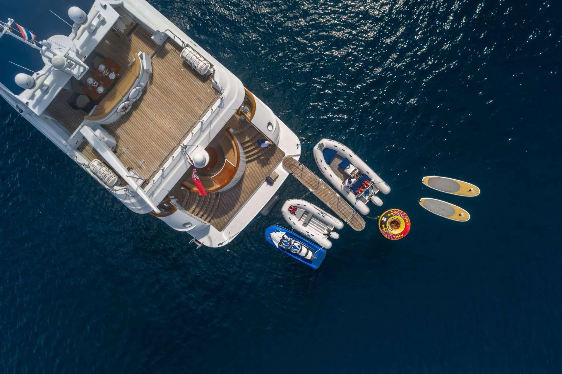 a space shuttle flying over a planet aboard XANADU OF LONDON Yacht for Charter