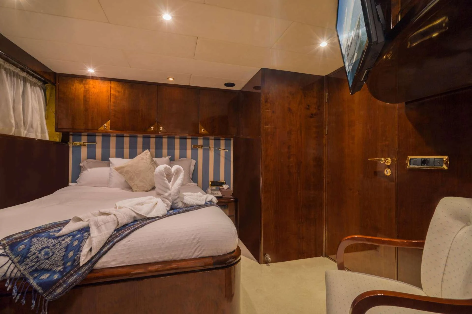 a bed in a room aboard XANADU OF LONDON Yacht for Charter