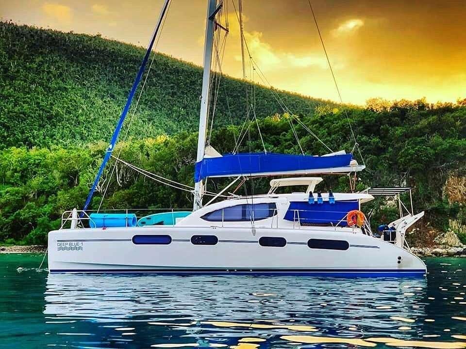 a white boat on water aboard DEEPBLUE Yacht for Charter