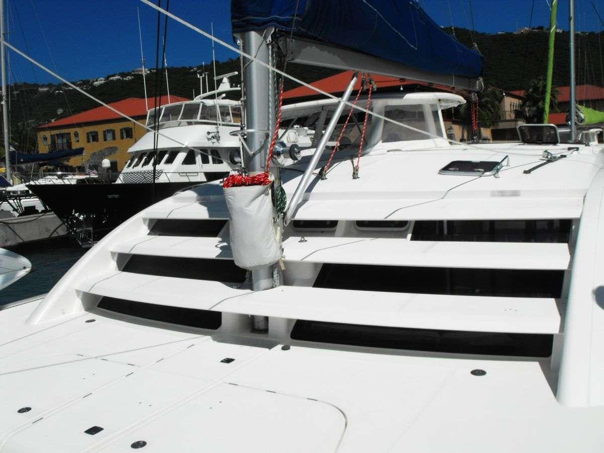 a white boat on a dock aboard DEEPBLUE Yacht for Charter
