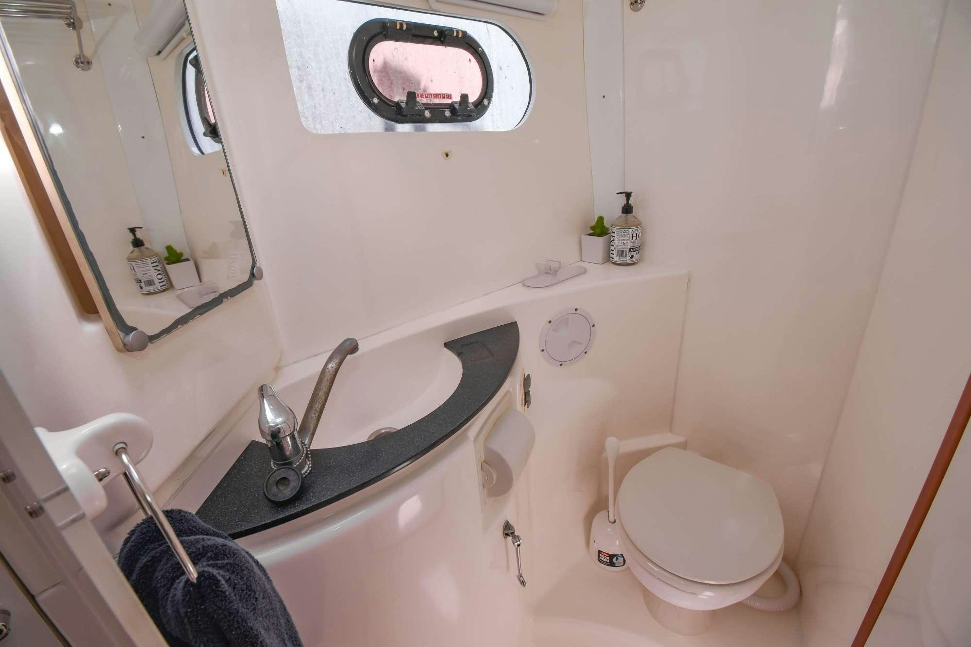 a bathroom with a large bathtub aboard DEEPBLUE Yacht for Charter