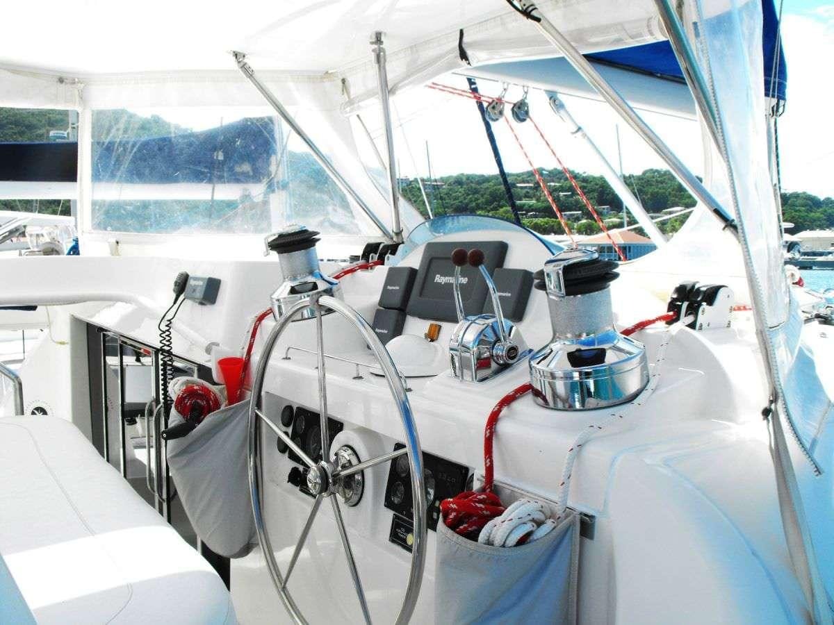 a boat with a white sail aboard DEEPBLUE Yacht for Charter