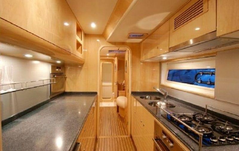 a kitchen with a large island aboard LUAR Yacht for Charter