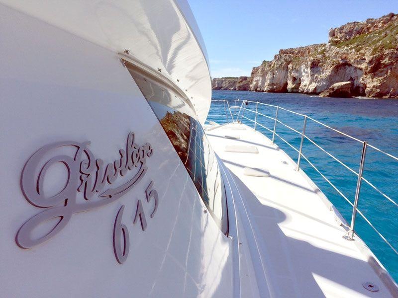 a white tent with a blue rope aboard LUAR Yacht for Charter