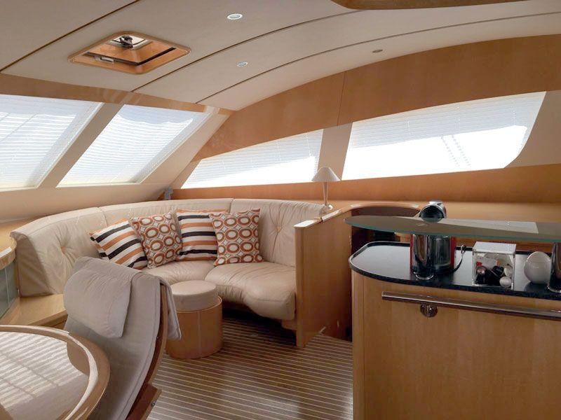 a room with a couch and a table aboard LUAR Yacht for Charter