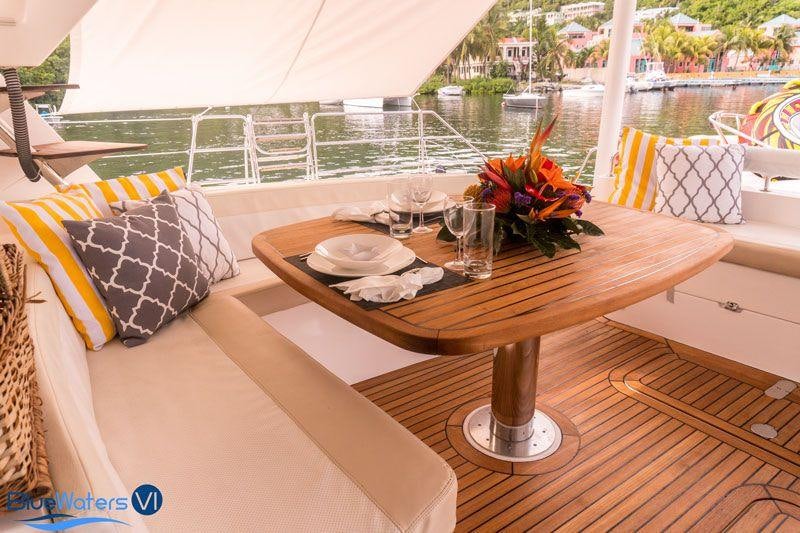 a table on a deck aboard LUAR Yacht for Charter