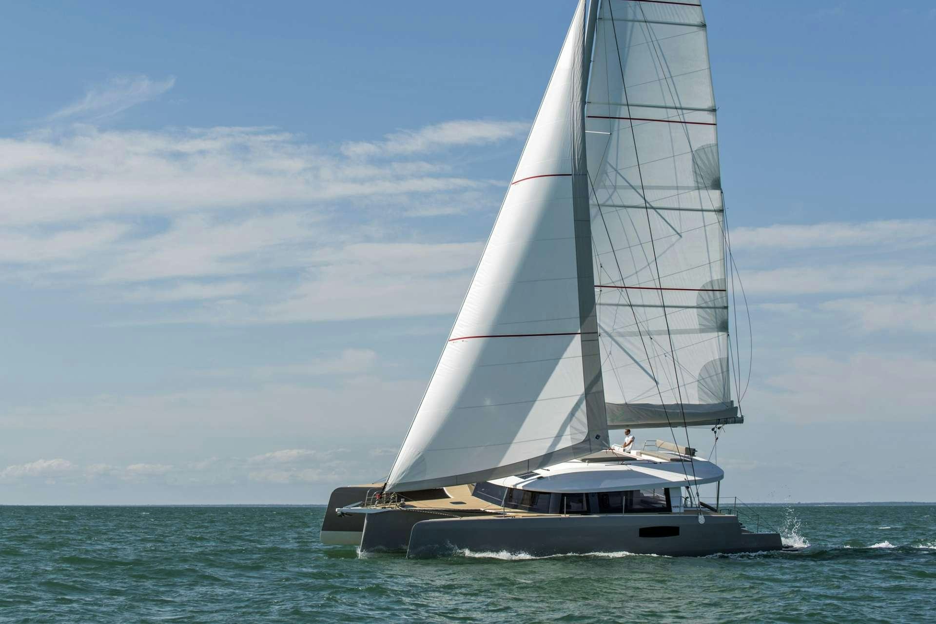 a sailboat in the ocean aboard TRILOGY Yacht for Charter