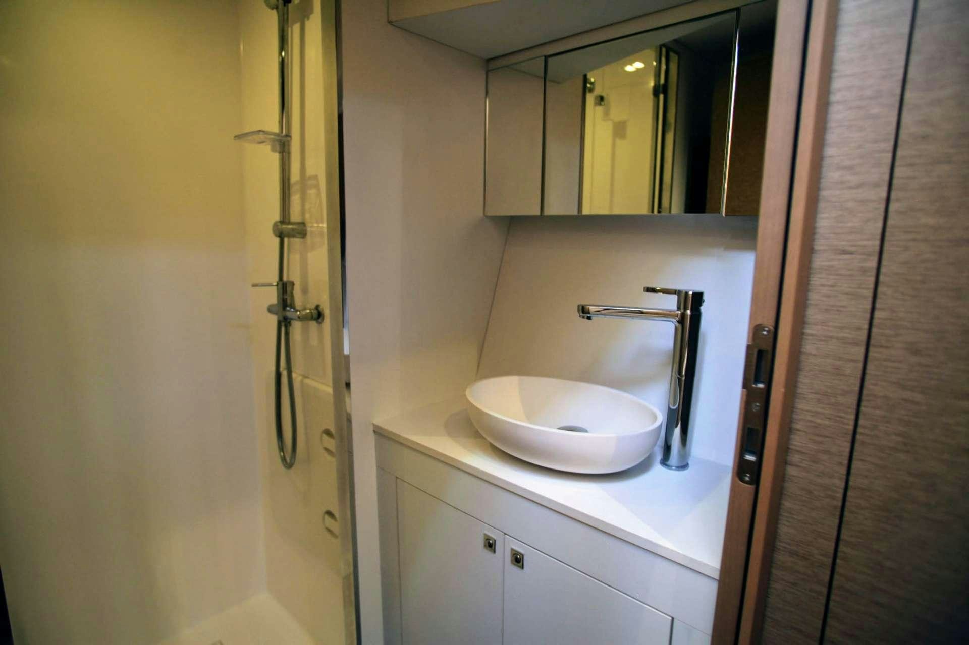 a sink in a bathroom aboard TRILOGY Yacht for Charter