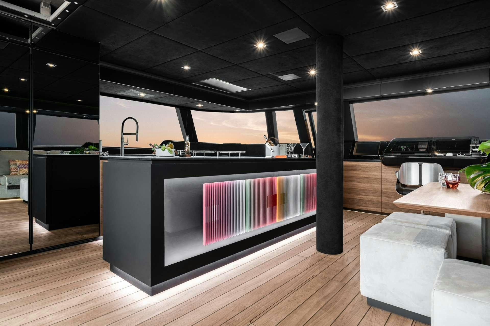a kitchen with a large island aboard E SUPERCAT Yacht for Charter