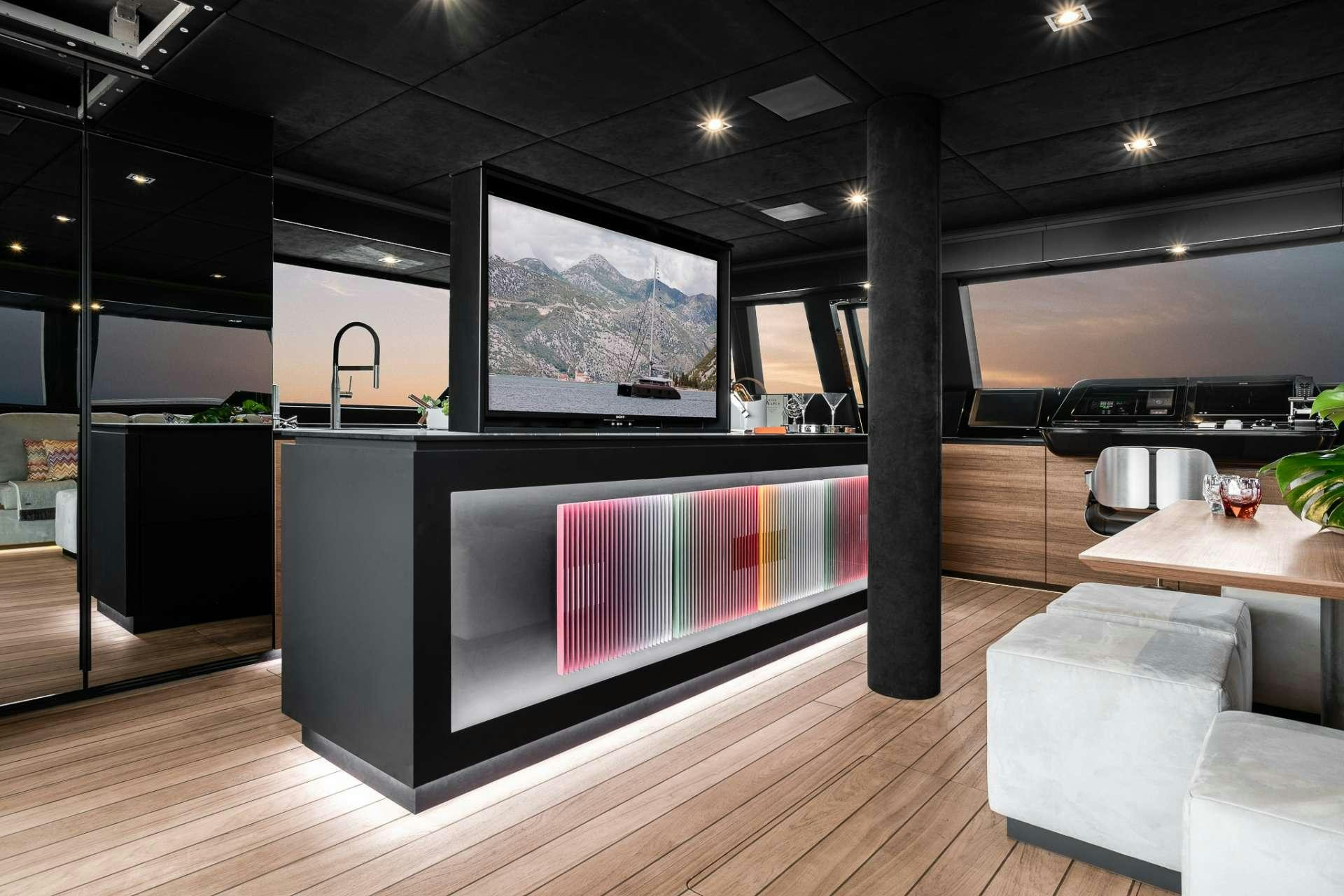 a room with a large tv aboard E SUPERCAT Yacht for Charter