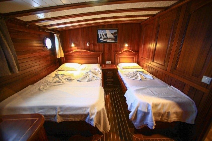 a room with two beds aboard DREAMLAND Yacht for Charter