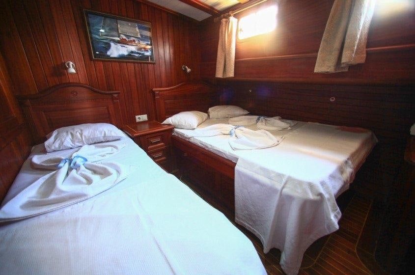 a couple of beds in a room aboard DREAMLAND Yacht for Charter