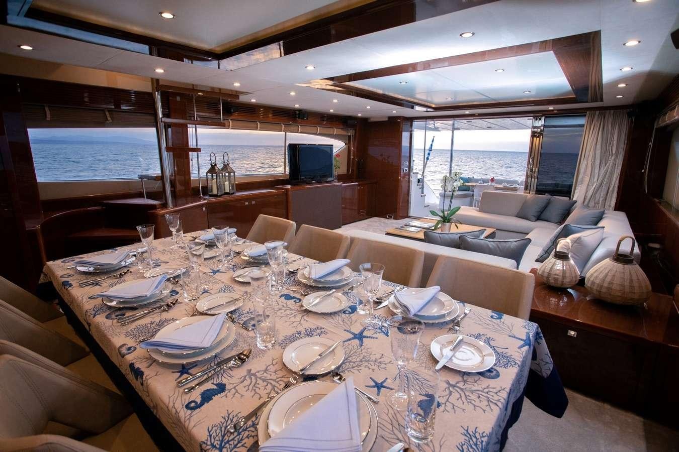 a dining room with a table set for a meal aboard GIA SENA Yacht for Charter
