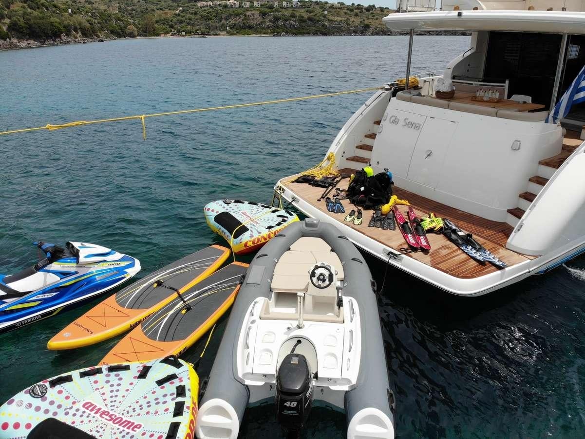 a group of boats sit on the water aboard GIA SENA Yacht for Charter