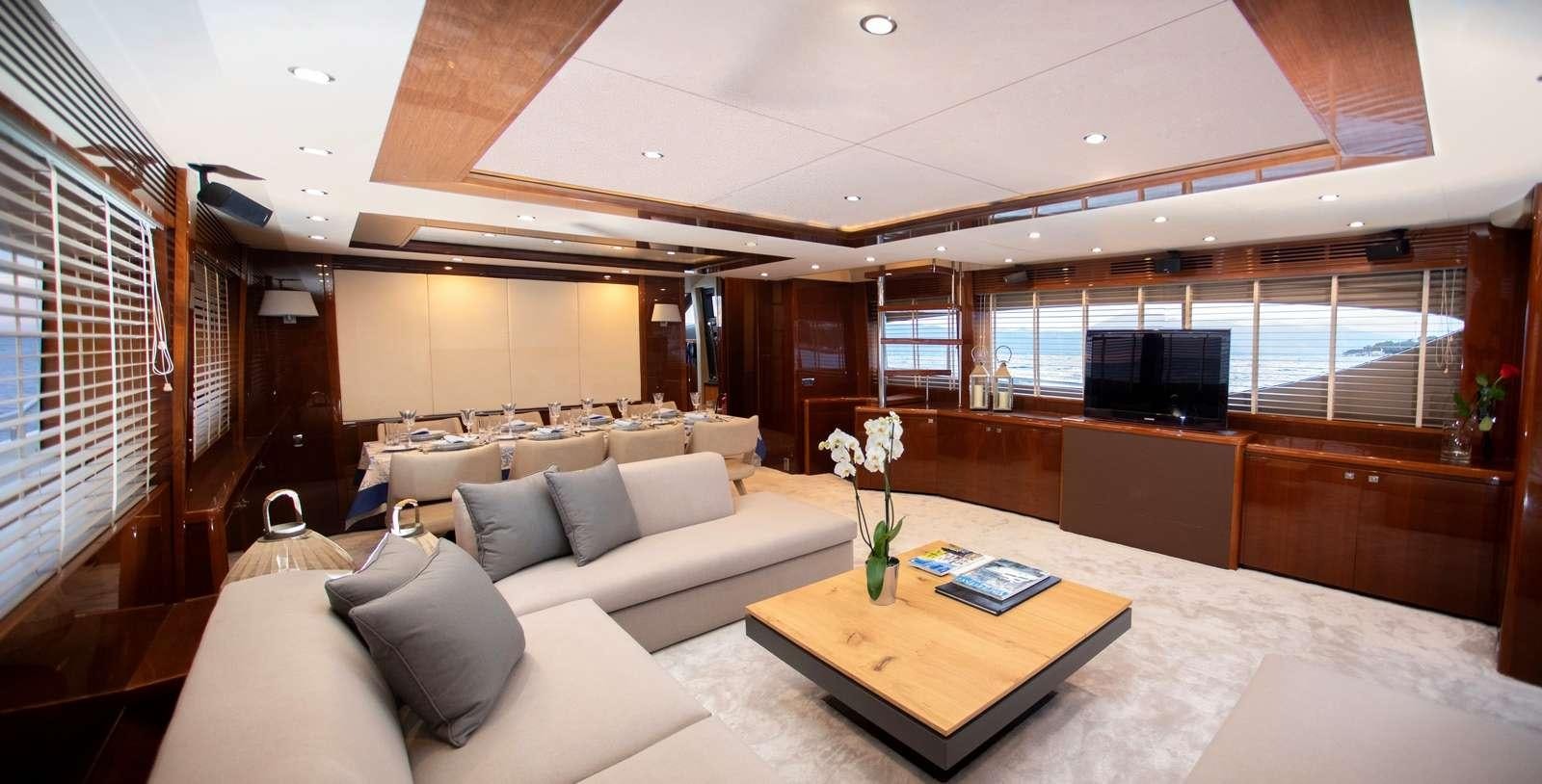 a room with a couch and a table aboard GIA SENA Yacht for Charter