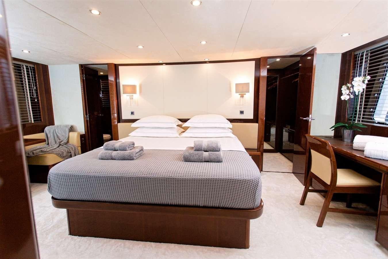 a large bed in a hotel room aboard GIA SENA Yacht for Charter