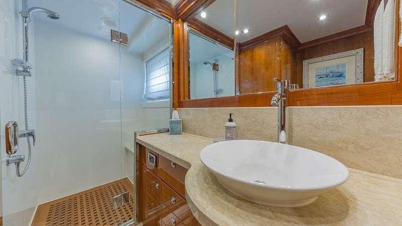 a bathroom with a sink and a mirror aboard HIGH RISE Yacht for Charter
