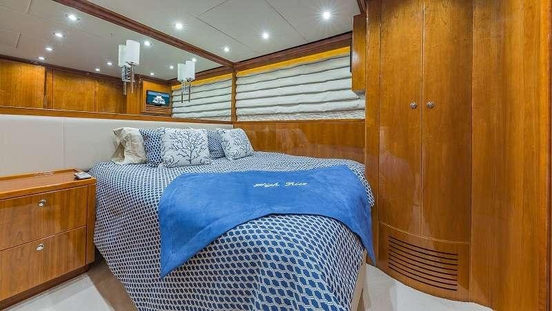 a bed in a room aboard HIGH RISE Yacht for Charter